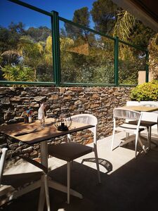 Shaded campsite restaurant terrace on the Côte d'Azur