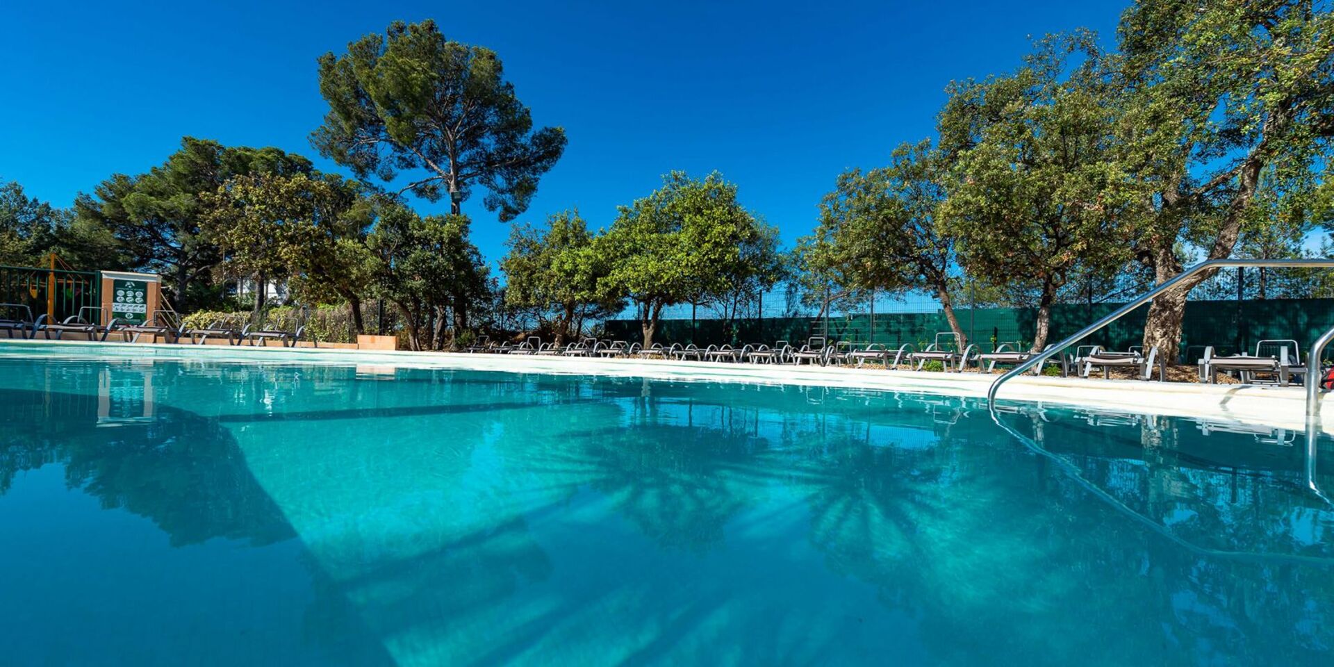 The campsite's family swimming pool in the sun